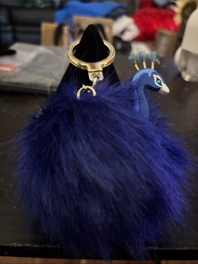 Kate Spade Plush Blue Peacock Pom Keychain with Gold Hardware
